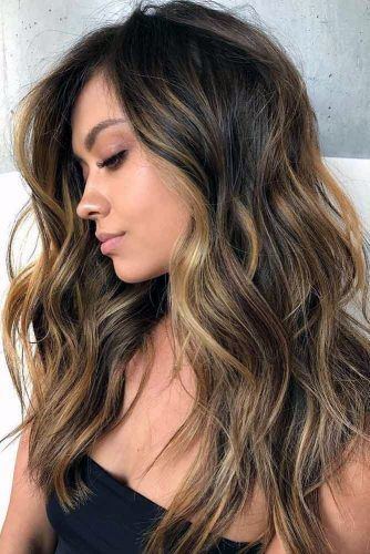 Beautiful Beachy Brown And Blonde Highlighted Textured Women’s Hairstyle Idea