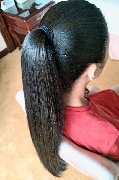 Beautiful Black Shiny And Sleek High Ponytail Womens Hair