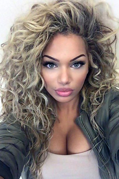 Beautiful Bouncy Dirty Blonde Natural Curls Women’s Hairstyle Idea Inspiration