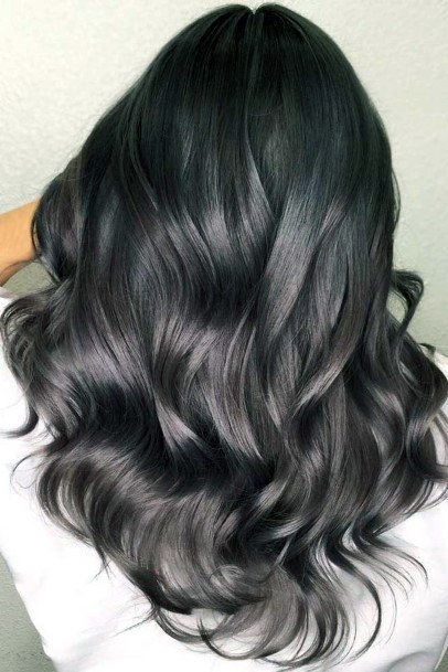 Beautiful Glossy Voluminous Style For Ladies With Dark Wavy Hair