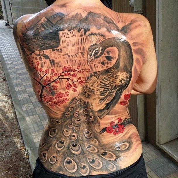 Beautiful Womens Back Tattoo Peacock