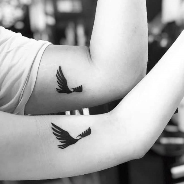 Bird In Flight Couple Tattoo Arms
