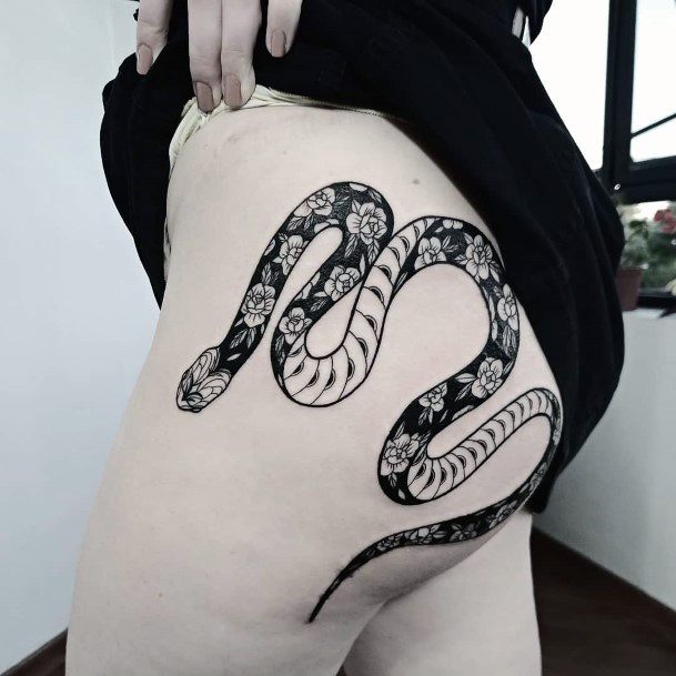 Black And White Flower Skinned Snake Tattoo Womens Thighs