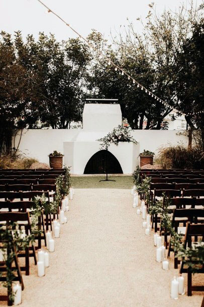 Black Chairs And White Backdrop Wedding Decor