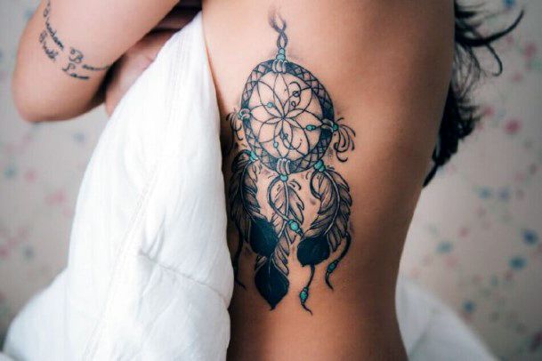 Black Dream Catcher With Blue Gems Tattoo For Women