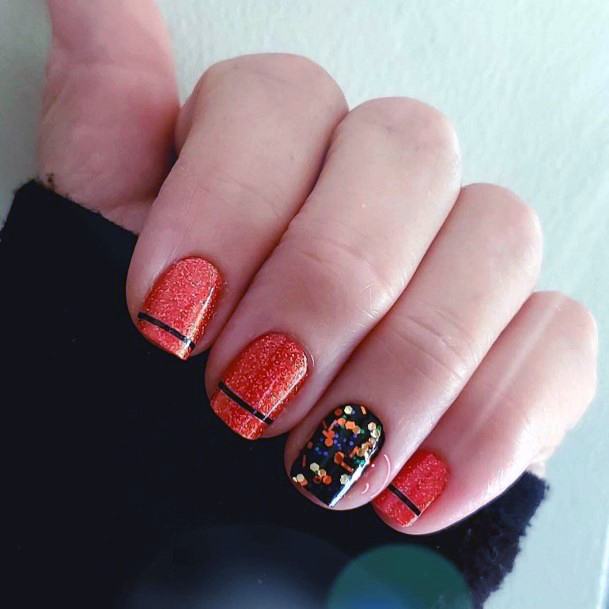 Black Lined Design On Red Orange Nails For Women