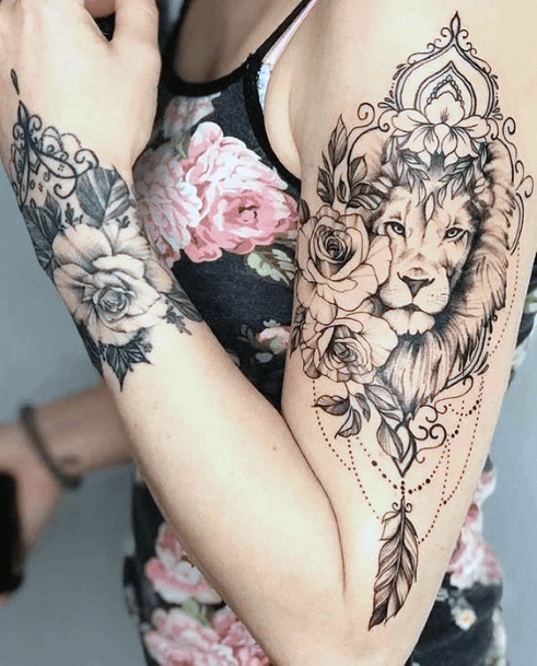 Black Rampant Lion With Leaves And Feather Tattoo Womens Arms