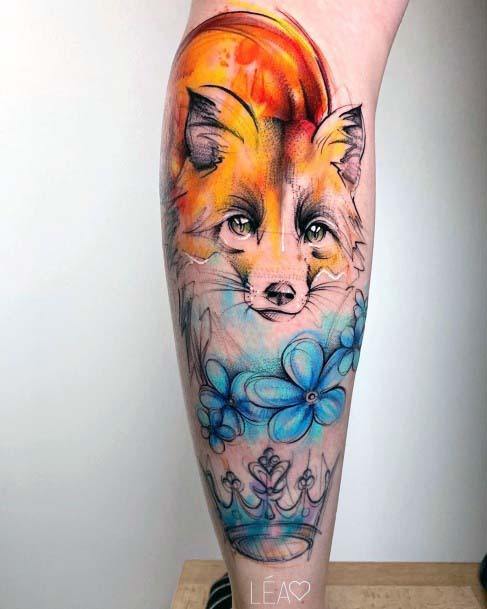 Blazing Fox Blue Flowers And Crown Tattoo Womens Legs