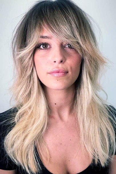 Blonde Feathery Wavy Hairstyles For Women With Fringe