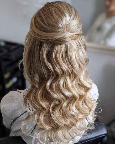 Blonde Female With Wavy Hair And Half Up Weave Pull Back