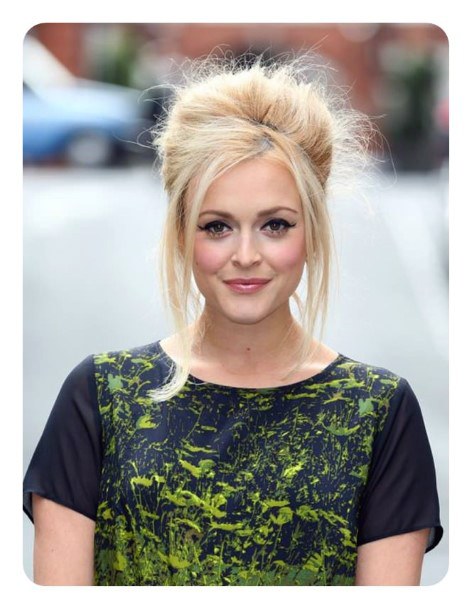 Blonde Girl With Messy Retro Beehive Hairstyle With Side Bangs