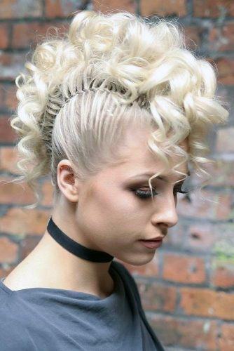 Blonde With Luxurious Long Wavy Hair Pulled Up In A Mohawk Style