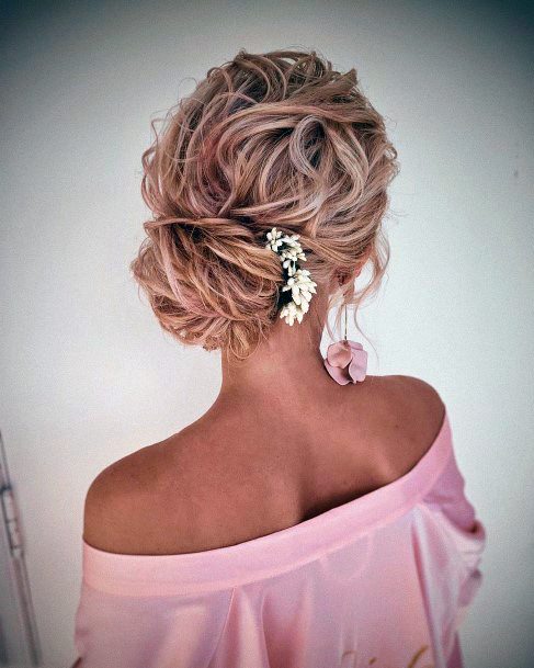 Blonde With Pink Highlights Pulled Into Wavy Low Neck Bun Updo Hairstyles For Women