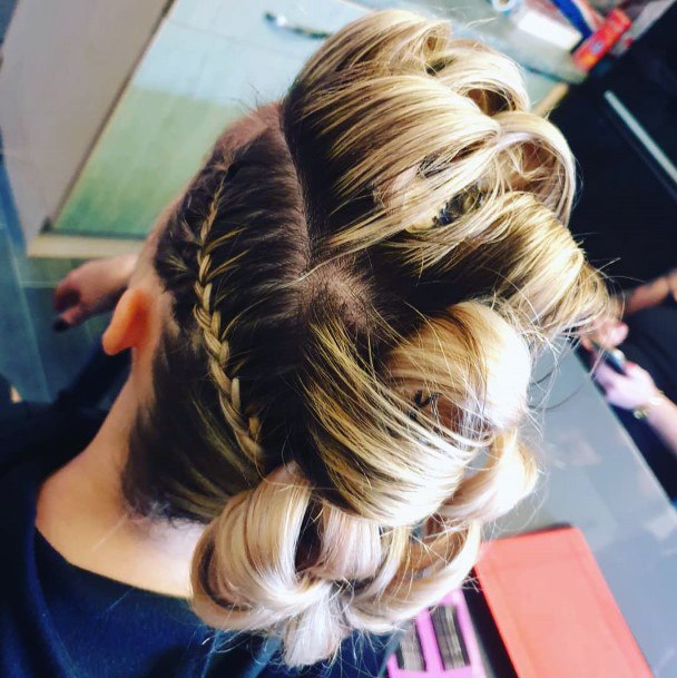 Blonde Woman With Multiple Wraps Corn Rows To Make Up Her Mohawk