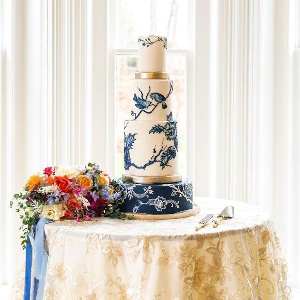 Blue Floral Art On White Wedding Cake