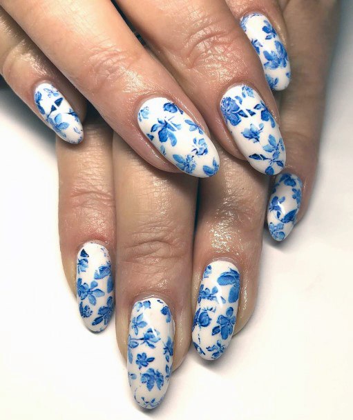 Blue Flower Pattern On White Painted Nails Women