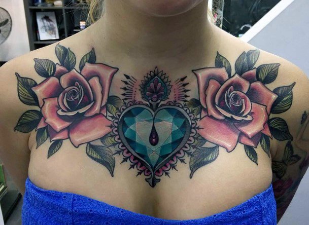 Blue Gem And Dual Roses Tattoo On Chest Women