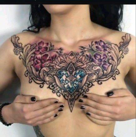 Blue Sapphire And Red Flowers Chest Tattoo Women