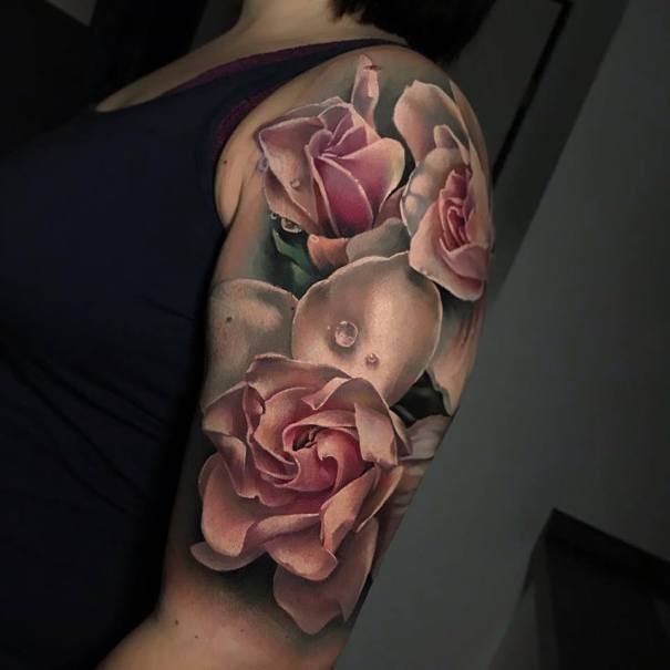 Blushing Pink Flowers And Black Tattoo Women Arms