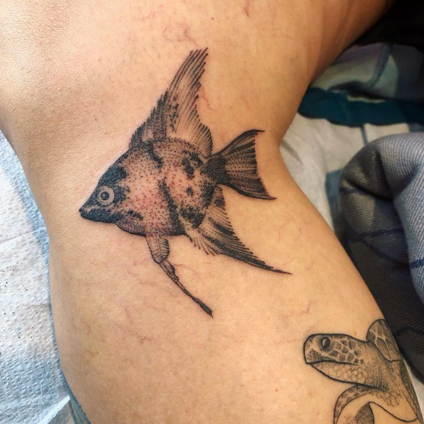 Breathtaking Angel Fish Tattoo On Girl