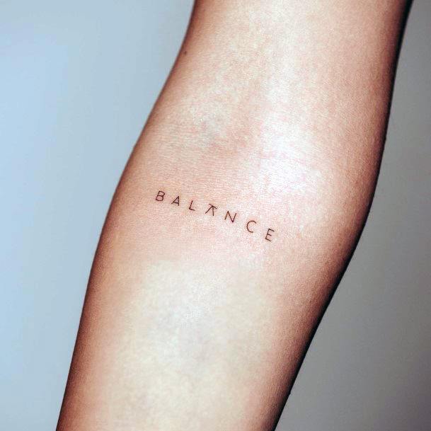 Breathtaking Balance Tattoo On Girl