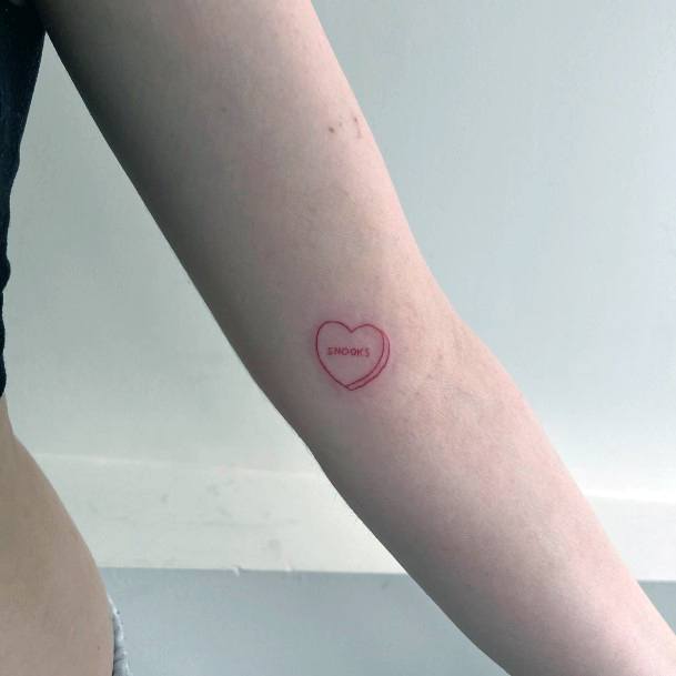 Breathtaking Candy Heart Tattoo On Girl