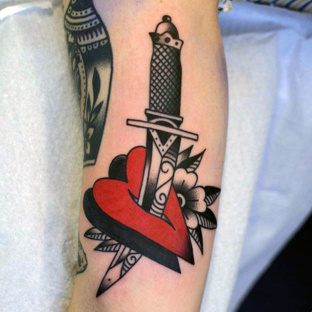 Breathtaking Dagger Heart Tattoo On Girl