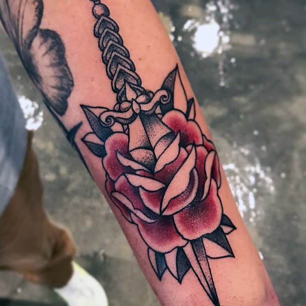 Breathtaking Dagger Rose Tattoo On Girl