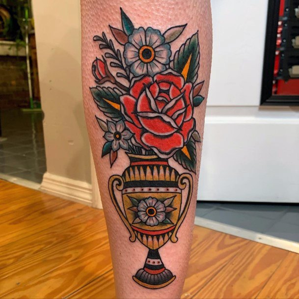 Breathtaking Flower Vase Tattoo On Girl