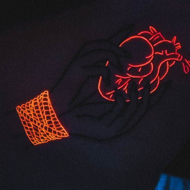 Breathtaking Glow In The Dark Tattoo On Girl Heart