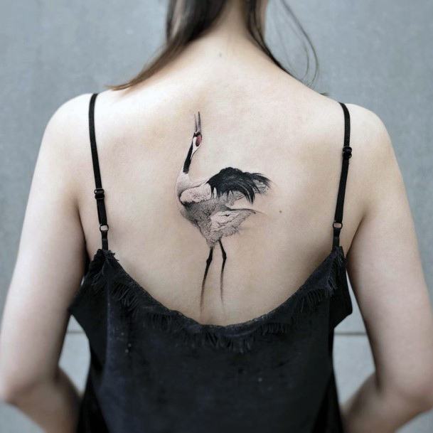 Breathtaking Good Tattoo On Girl Crane Back