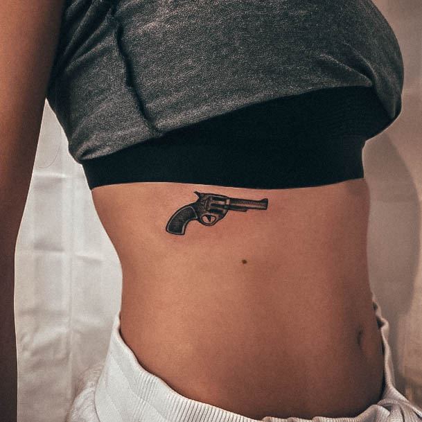 Breathtaking Gun Tattoo On Girl