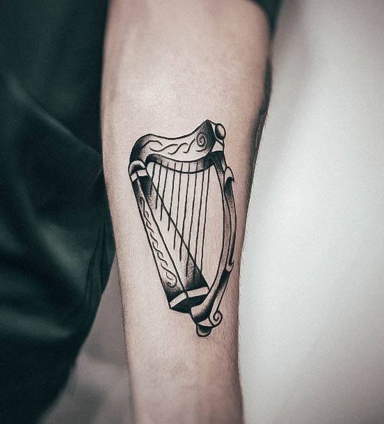 Breathtaking Harp Tattoo On Girl