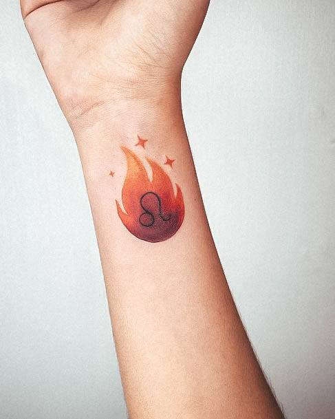 Breathtaking Leo Tattoo On Girl Wrist Comet