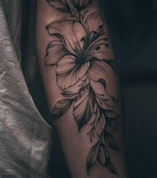 Breathtaking Lily Tattoo On Girl Arm