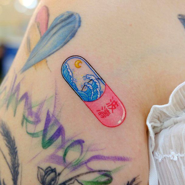 Breathtaking Pill Tattoo On Girl