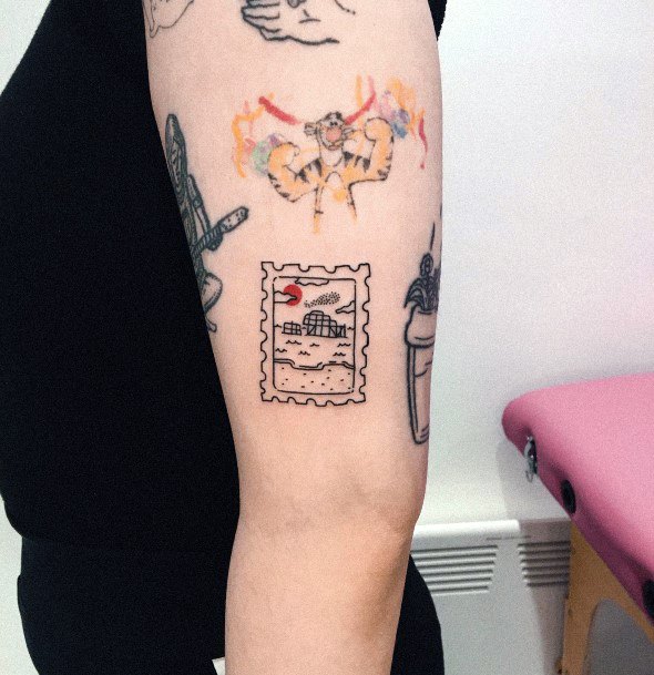 Breathtaking Postage Stamp Tattoo On Girl