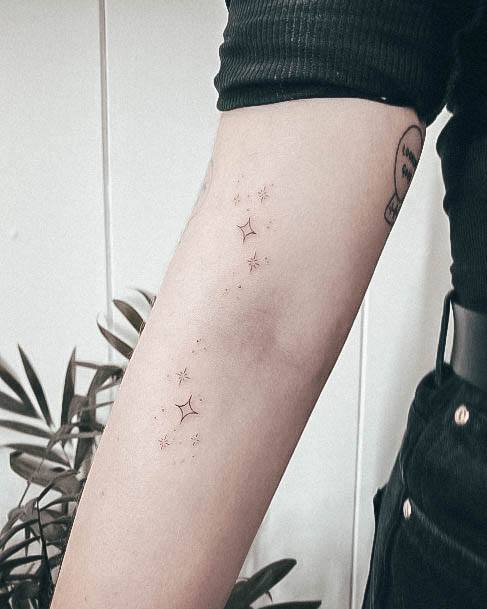 Breathtaking Star Tattoo On Girl Forearm