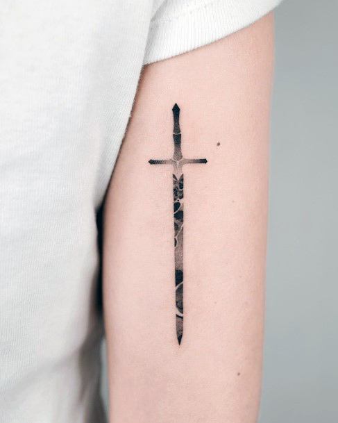 Breathtaking Sword Tattoo On Girl