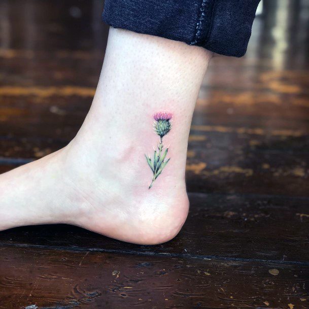 Breathtaking Thistle Tattoo On Girl