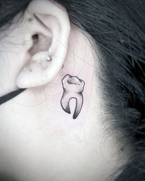 Breathtaking Tooth Tattoo On Girl