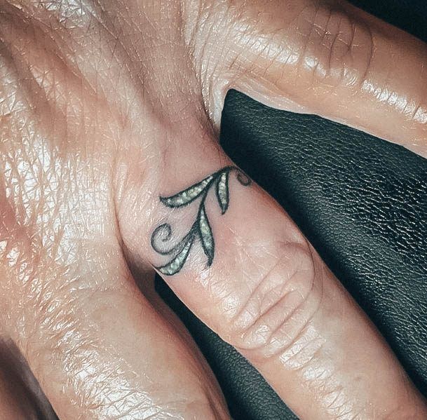 Breathtaking Wedding Ring Tattoo On Girl Leaves