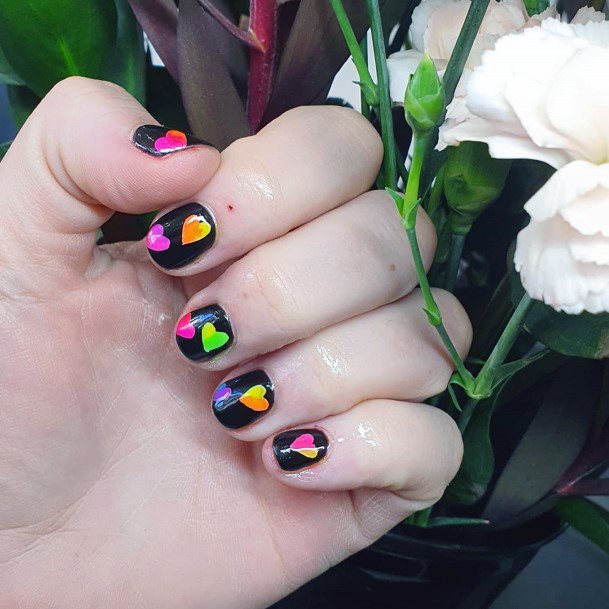 Bright Colored Hearts On Black Colored Nails For Women