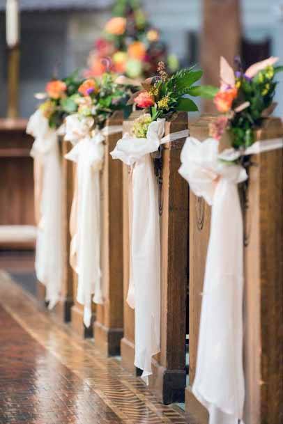 Bright Florals And White Ribbon Church Wedding Decorations