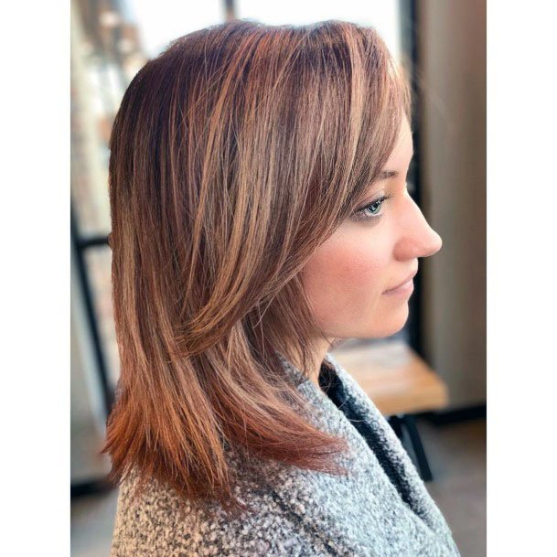 Brown And Blonde Highlighted Simplistic Layered Shoulder Length Womens Hairstyle