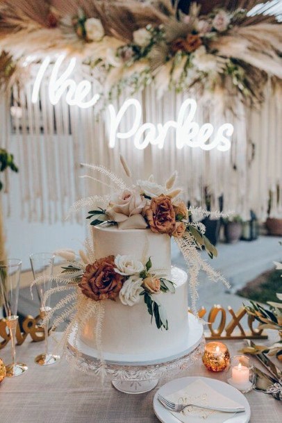 Brown And White Roses On Rustic Wedding Cake