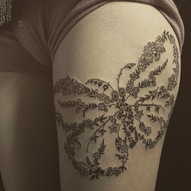 Butterfly Made With A String Of Flowers Tattoo On Arms For Women