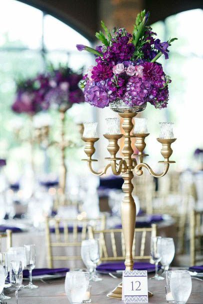 Candle Stand And Purple Wedding Flowers