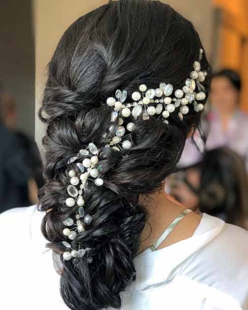 Cascading Dark Curls With Pearls Hairstyle Women