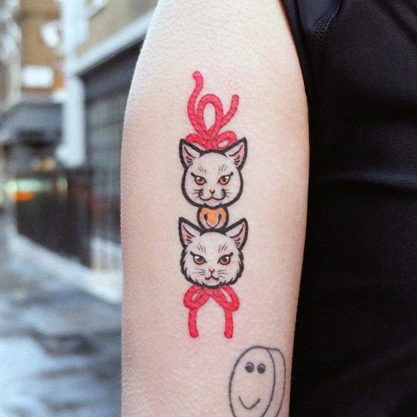 Cat Heads Tied In Red Rope Tattoo For Women
